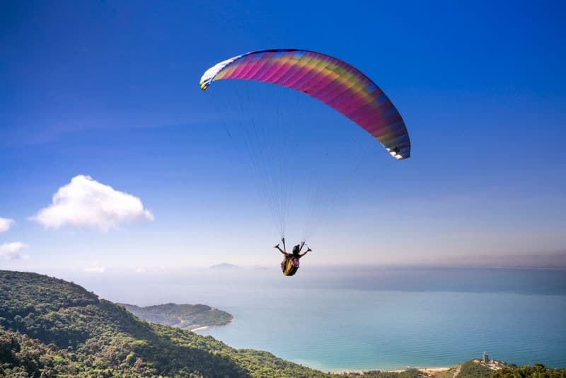 Tandem Alpine Paragliding Flight Over Lakes